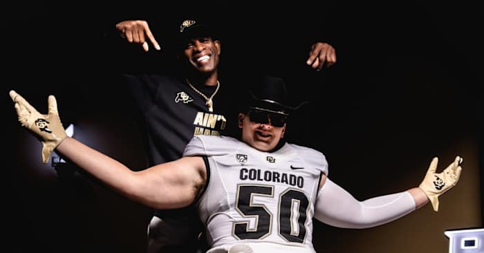 Colorado Buffaloes Talan Chandler poses with Deion Sanders